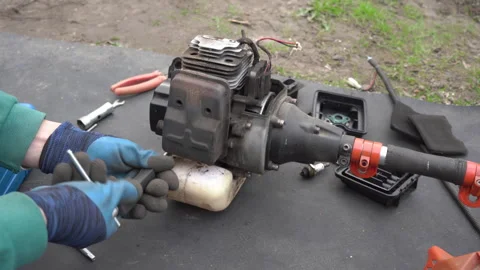 Remove the muffler brush cutter Stock Footage 255407772