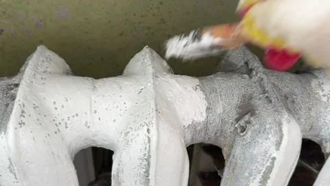 Remove old paint from Radiator. Sanding rusty radiator for painting. Stock Footage 274343675
