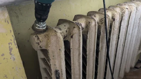 Remove old paint from Radiator. Sanding rusty radiator for painting. Stock Footage 276737376