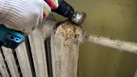 Remove old paint from Radiator. Sanding rusty radiator for painting. Stock Footage 276737377