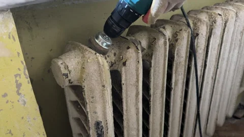Remove old paint from Radiator. Sanding rusty radiator for painting. Stock Footage 276737513