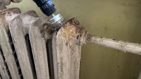 Remove old paint from Radiator. Sanding rusty radiator for painting. Stock Footage 276737732