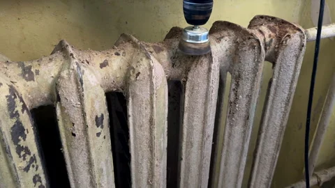 Remove old paint from Radiator. Sanding rusty radiator for painting. Video stock 276738318
