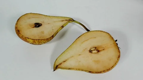 Remove a pear on the table, after cutting Stock Footage 90352919