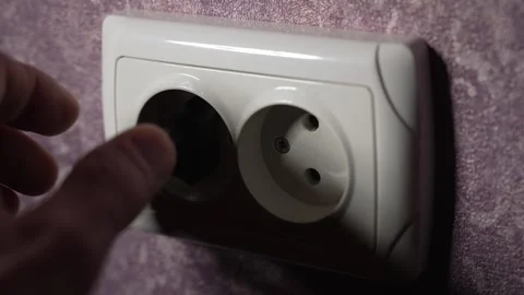 Remove the plug from the electrical appliance from the socket. Slow motion Stock Footage 244662772