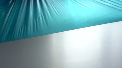 Remove the protective film from the panel. Worker removes the protective film Stock Footage 149409618