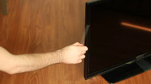 Remove Protective Tape From TV Video stock 35554138