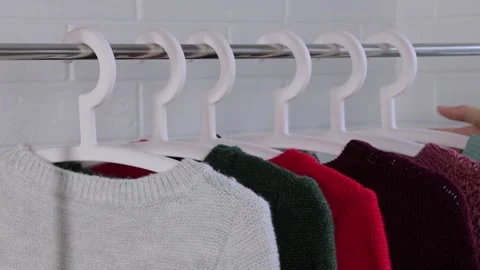 Remove the racks of clothes. Shopping at the Mall. To collect things in the ride Stock Footage 135534894