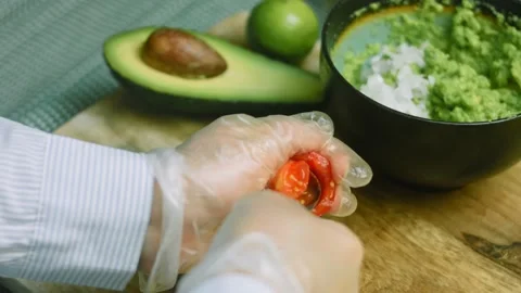 Remove the tomato seeds with a spoon Stock Footage 169350229