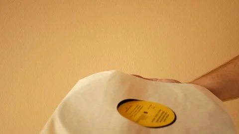 Remove vinyl record from paper sleeve Stock Footage 95271441