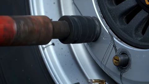 Remove wheel from truck, replacing wheel, service, replacing with winter tires Stock Footage 119053100