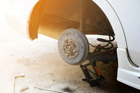 Remove the white car wheels to make repairs. Stock Photos