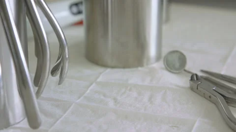 The removed brackets on a table with tools of the stomatologist Stock Footage 94417918