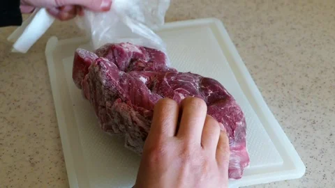Removed from the freezer deep frozen beef Stock Footage 101094971