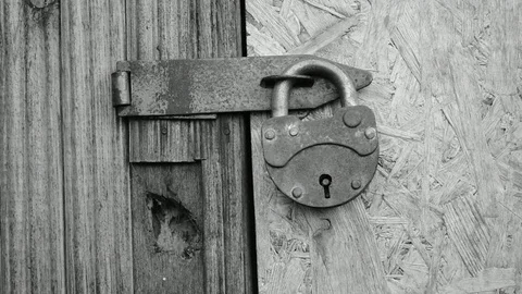 Removes the lock from the utility room Stock Footage 117473034