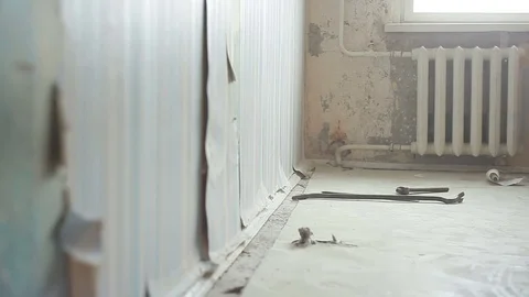 Removes the old baseboard Stock Footage 83382224