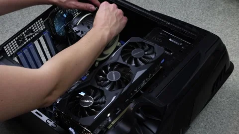 Removing and dusting processor cooler from PC computer case, computer Stock Footage 320223403