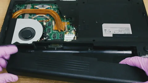 Removing and installing battery in the laptop Stock Footage 66423541