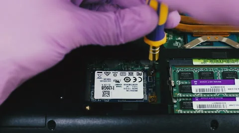 Removing and installing mSATA SSD in the laptop Vídeo Stock 66360963