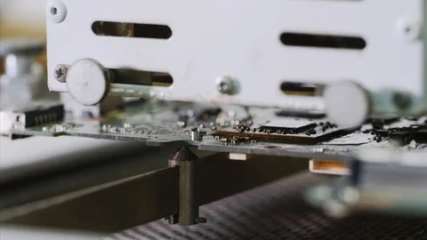 Removing and installing video chip on motherboard in soldering station machine. Video stock 114609124