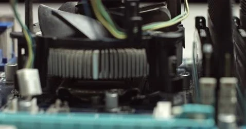 Removing And replacing CPU cooler on modern PC computer motherboard. Installing Stock Photos