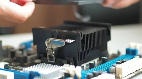 Removing And replacing Fan CPU on the motherboard. Installing and removing ve Stock-Footage 81431288