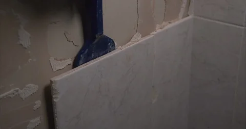 Removing bathroom tiles using a chisel Stock Footage 101813744