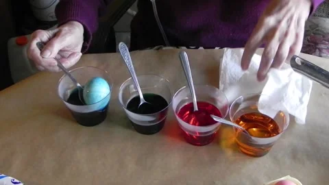 Removing Blue Egg From Dye Stock Footage 150316488