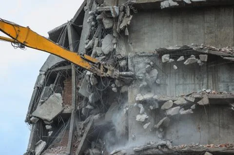 Removing a building with a excavator Stock Photos