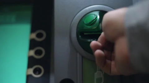 Removing the card from the ATM. Stock-Footage 65295104