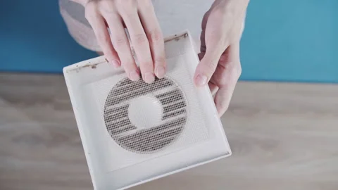 Removing Clogged Mesh Filter Mesh from Dirty Bathroom Air Vent Vídeo Stock 341397012