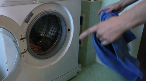 Removing clothes from the washing machine Stock Footage 55533683