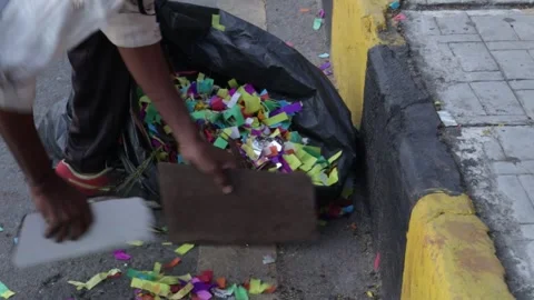 Removing confetti from the road Stock Footage 284825419