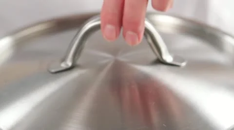 Removing cooked artichokes from water Stock Footage 24661711
