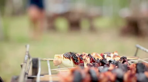Removing cooked kebabs from grill Stock Footage 63305770