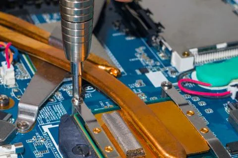 Removing the cooling system from the processor Stock Photos