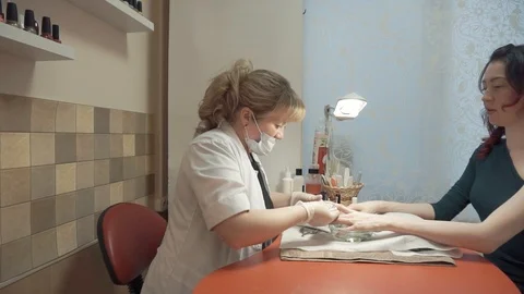 Removing cuticles with pusher Stock Footage 87825364