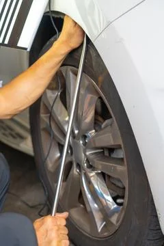 Removing dents on the car. PDR technology. Car body repair without painting. Stock Photos