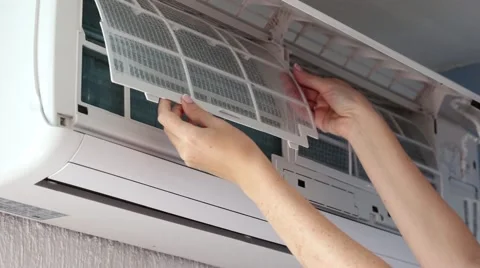 Removing dirty filter of air conditioner Split-system for cleaning and washing Stock Footage 62195740