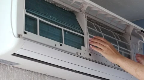 Removing dirty filter of air conditioner Split-system for cleaning and washing Stock Footage 62750879
