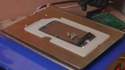 Removing the display from a smartphone Stock Footage 172059835