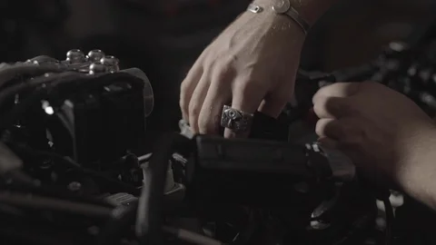 Removing ECU from a motorcycle in a workshop Stock Footage 125446235