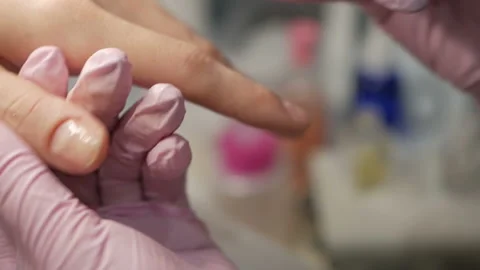 Removing excess cuticles using hardware manicure process in beauty salon. Stock-Footage 105681414