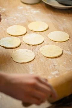 Removing excess dough from cut circle templates photo 스톡 사진