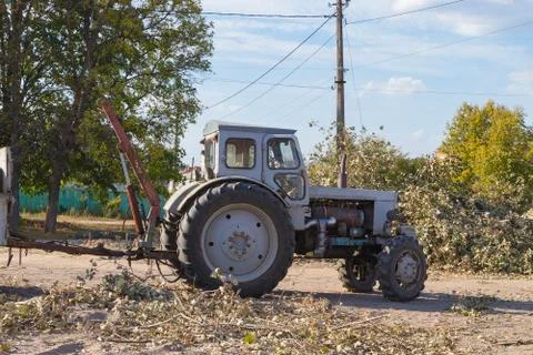 Removing fallen tree with tractor and loader Stock Photos