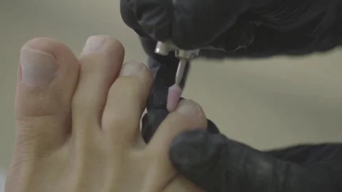 Removing fingernail cuticles with drill machine, polishing Stock Footage