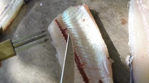Removing fisbones of pike Stock Footage 52315995