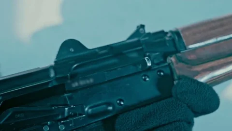 Removing fuse ak 47. Reloading assault kalashnikov rifle Stock Footage 74089172