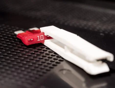 Removing fuse with tool Foto stock