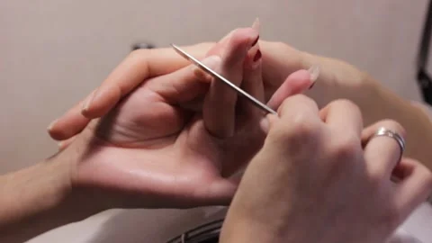 Removing the gel coating from the nails Stock Footage 149121951